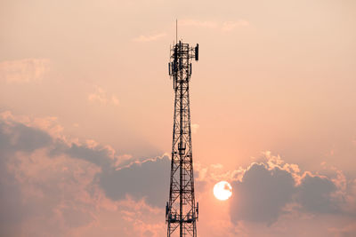 Low angle view of communications tower against sky