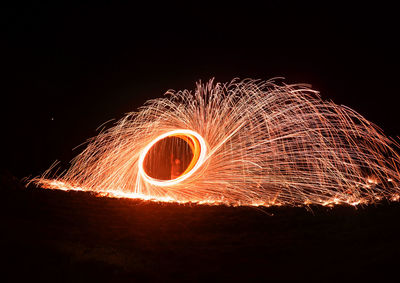 Light painting against sky at night