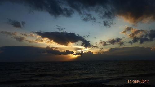 Scenic view of sea against sky at sunset
