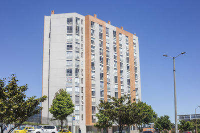 Low angle view of building against clear blue sky