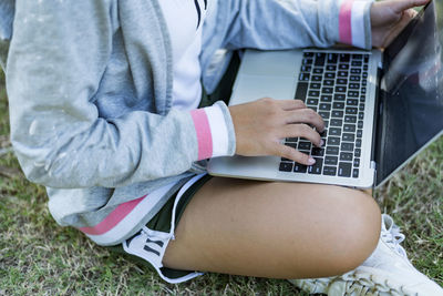 The girl with laptop on outdoor