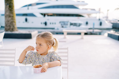 Portrait of smiling young woman drinking water