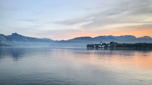 Scenic view of lake against sky during sunset