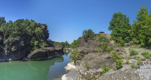 Scenic view of rocks against clear sky