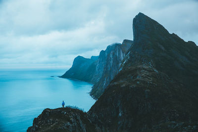 Panoramic shot of rocks on sea against sky