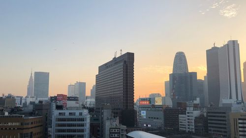 View of cityscape against sky during sunset