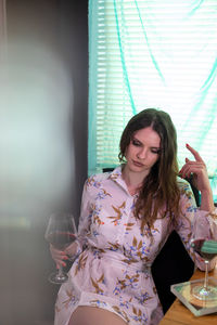 Young woman drinking beer glass