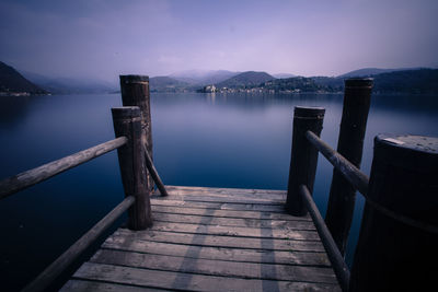 Scenic view of lake against cloudy sky