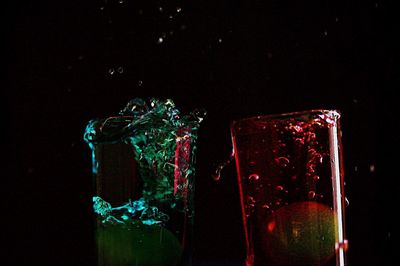 Close-up of red wine against black background