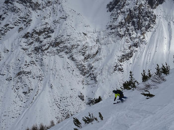 High angle view of man skiing on snowcapped mountain