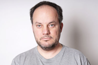 Portrait of man against white background