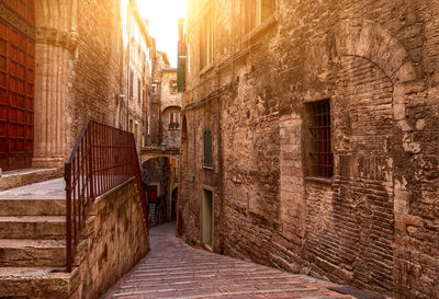 Alley amidst buildings in city