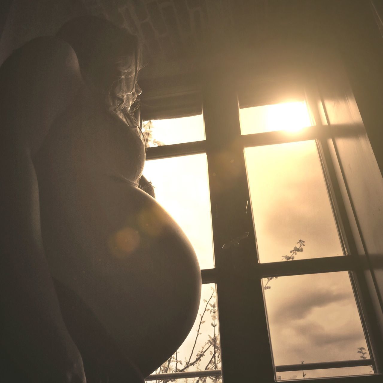 sun, indoors, sunlight, low angle view, sunbeam, sunset, silhouette, sky, lens flare, window, built structure, nature, architecture, back lit, railing, cloud - sky, reflection, day