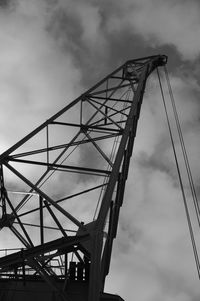 Low angle view of bridge against cloudy sky