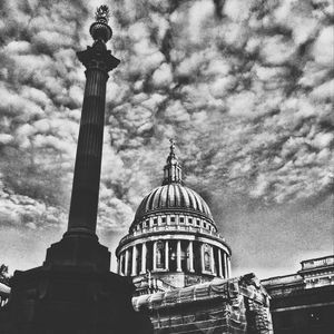 Low angle view of temple against cloudy sky