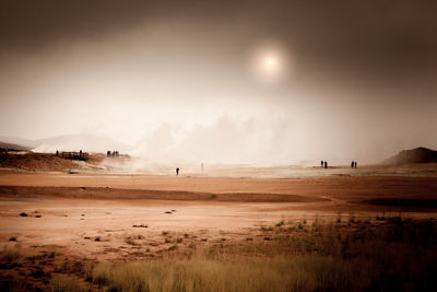 View of beach against cloudy sky