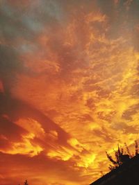 Low angle view of dramatic sky during sunset