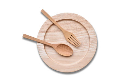 High angle view of bread in plate against white background