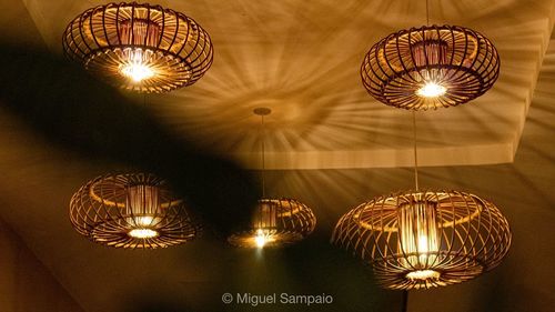 Low angle view of illuminated pendant light