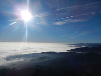 Sun shining through clouds