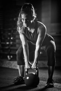 Young woman exercising at gym