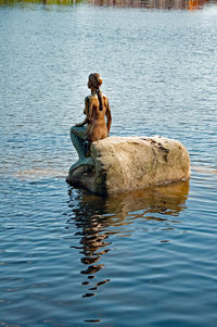 Man sitting in lake