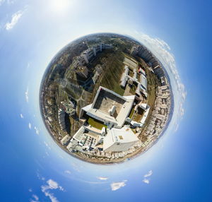 Digital composite image of buildings against sky