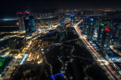 High angle view of illuminated buildings in city at night