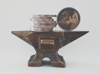 Close-up of coin against white background