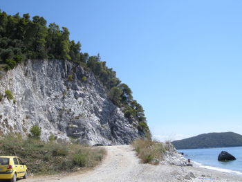 Scenic view of river with mountains in background