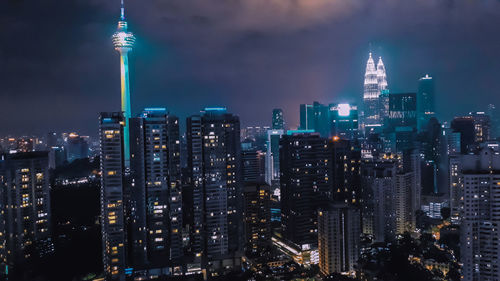 Illuminated buildings in city at night