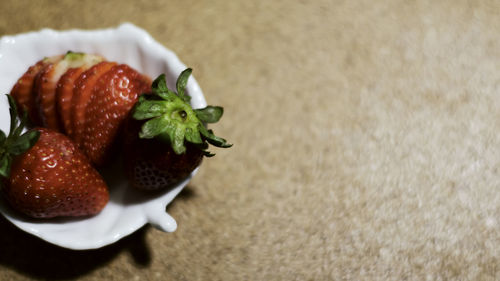 High angle view of strawberries on table