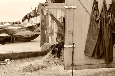 Rear view of woman on building