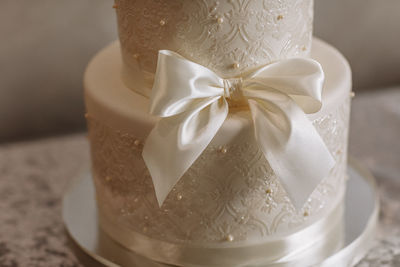 Close-up of wedding rings on table