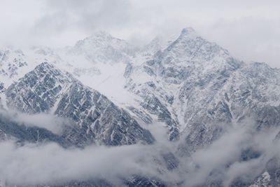 Snow covered mountains against sky
