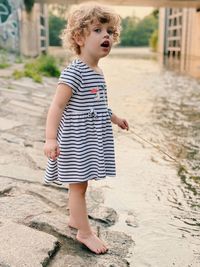 Full length of cute girl standing outdoors