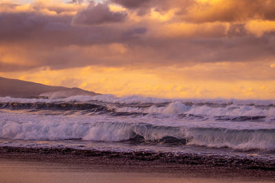 Waves in the atlantic ocean, before sunset, colorful sky, azores travel destination.