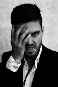 Close-up portrait of young man making face