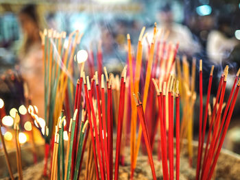 Close-up of burning incense in temple