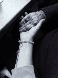 Cropped woman hand holding grandmother