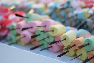 Close up of colorful marshmallows in sticks