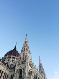 Low angle view of cathedral against clear blue sky