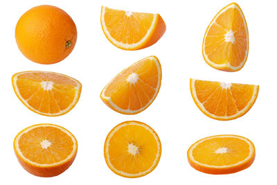 Close-up of oranges against white background