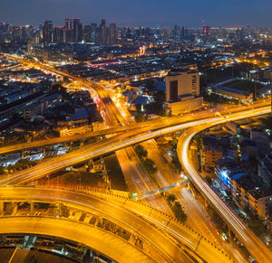 High angle view of illuminated city street at night