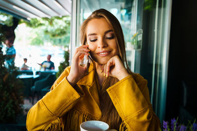 Young woman using mobile phone