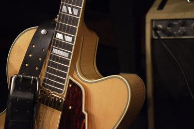 Close-up of belt on guitar