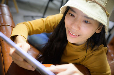 Portrait of woman holding camera