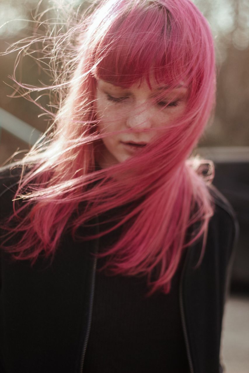 PORTRAIT OF A YOUNG WOMAN WITH HAIR