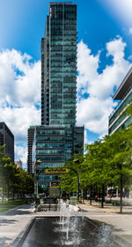 Modern buildings in city against sky