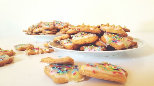 Close-up of cookies over white table